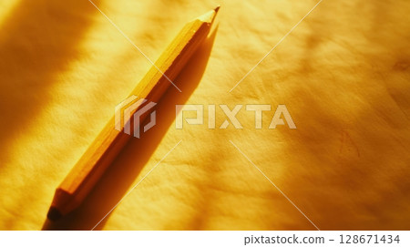 A Pencil and Golden Light. 128671434