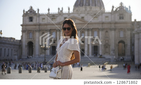 Visitor at St Peter Basilica admiring colonnades at sunset light  128671802