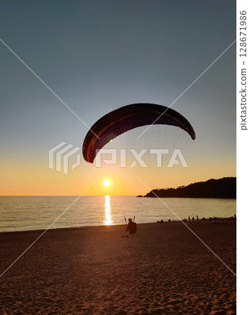 beautiful landscape with a view of the sea flying on a paraglider 128671986
