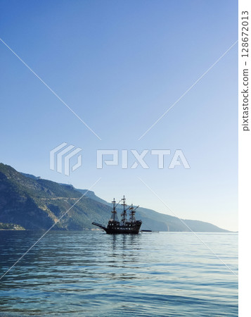 a beautiful ship is sailing in the blue sea 128672013