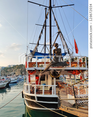 beautiful ships and boats are moored near the shore beautiful ships and boats are moored near the shore 128672034