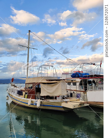 beautiful ships and boats are moored near the shore 128672071