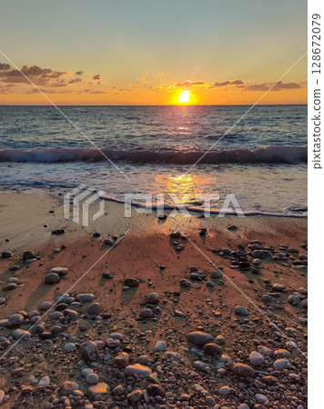 beautiful dramatic landscape of sunset on the sea beach 128672079