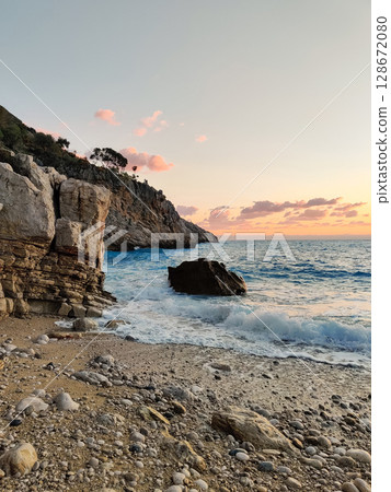 beautiful dramatic landscape of sunset on the sea beach 128672080