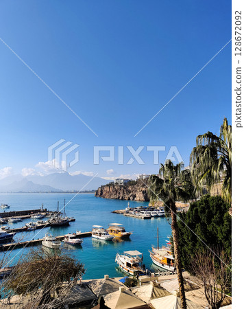beautiful ships and boats are moored near the shore 128672092