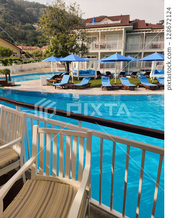 a beautiful large swimming pool near the house 128672124