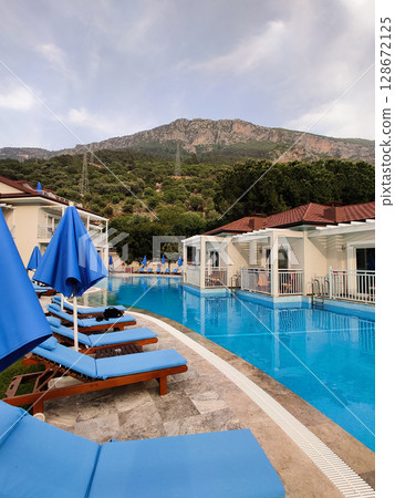 a beautiful large swimming pool near the house 128672125