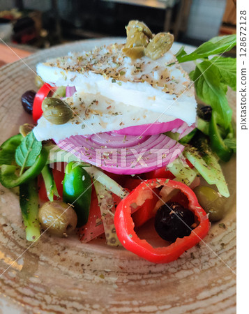 a delicious dish of vegetable salad on a plate in a restaurant a delicious dish of vegetable salad on a plate in a restaurant 128672128