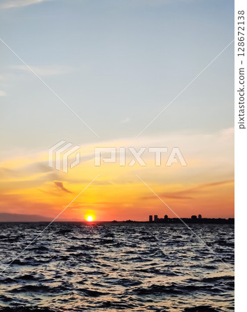 beautiful dramatic landscape of sunset on the sea beach 128672138
