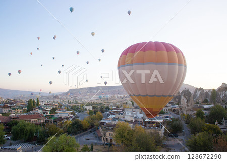 beautiful scenery flight of balloons in the mountains of Cappadocia in love valley 128672290