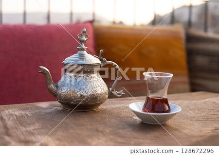 traditional turkish black tea on table with teapot 128672296