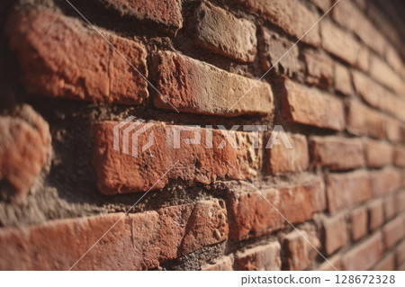 Aged red brick wall with rustic texture and natural weathering, ideal for architecture, restoration, or heritage masonry detail references 128672328