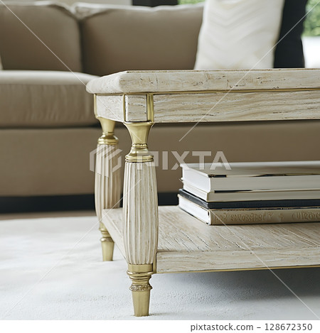 A white coffee table with a book on top of it 128672350