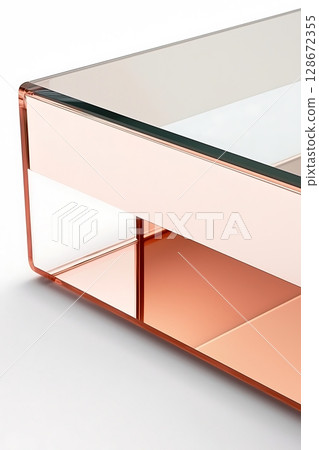 A glass coffee table with a gold frame 128672355