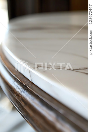 A marble table with a wood frame 128672447