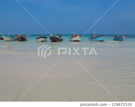 fishing motor boats moored on the sea coast 128672520
