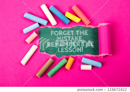 Inspirational Quote About Learning from Mistakes Surrounded by Colorful Chalk on Pink Background 128672822