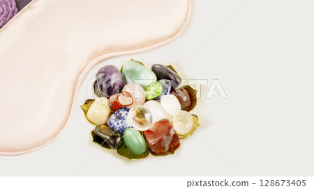 Relaxing ritual with crystals gemstones set and sleep mask on white background with copy spac. Esoteric spiritual practice, Healing Crystal Ritual, Relax Chakra. Relaxing at home, self care concept 128673405