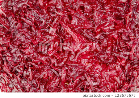 Vegetable background with close up of boiled grated beets. Vegan and vegetarian background Vegetable background with close up of boiled grated beets. Vegan and vegetarian background 128673675