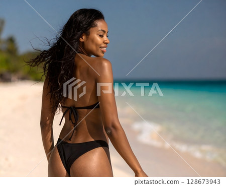 Beautiful Woman on Tropical Beach 128673943