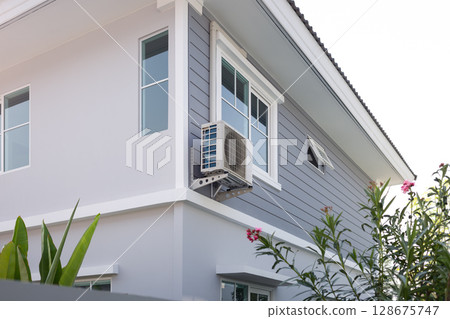 Condenser unit and contemporary house. Condenser unit and contemporary house. 128675747