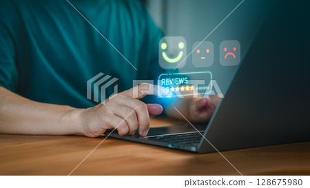 Customer gives a 5 star rating on a digital review system using a laptop. Business service of customer satisfaction, review, positive user experience, decision-making in an online feedback system. 128675980