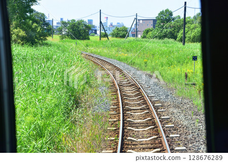 View from the train window on JR Hokkaido's Nemuro Line from Kushiro Station to Kamiohoro Station 128676289