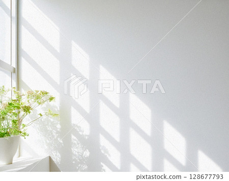 A room with bright sunlight coming in through the window and plants 128677793