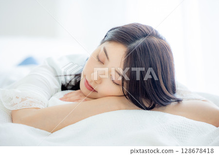 Young woman sleeping in the bedroom Young woman sleeping in the bedroom 128678418