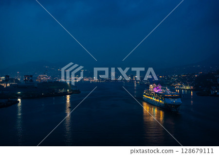 Cruise ship departing from Nagasaki Port (Star Navigator) Night view illuminated from Megami Ohashi Bridge [Nagasaki City] 128679111