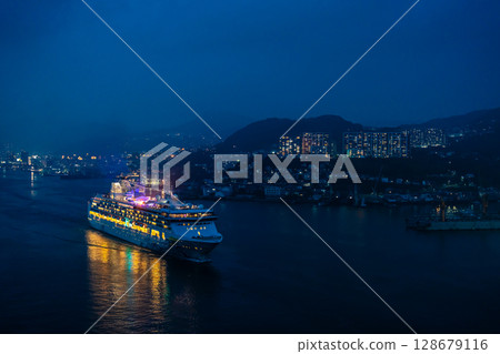 Cruise ship departing from Nagasaki Port (Star Navigator) Night view illuminated from Megami Ohashi Bridge [Nagasaki City] 128679116