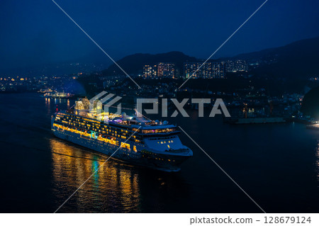 Cruise ship departing from Nagasaki Port (Star Navigator) Night view illuminated from Megami Ohashi Bridge [Nagasaki City] 128679124