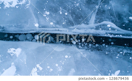 Blue cold ice lake with aerial texture 128679436