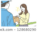 Young woman receiving a package from a delivery driver 128680290