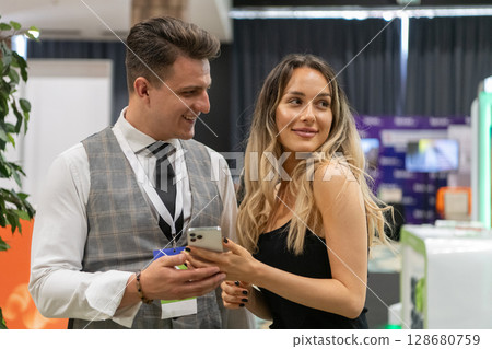 Professional Interaction at a Business Event Capturing Confidence and Engagement. Professional Interaction at a Business Event Capturing Confidence and Engagement. 128680759