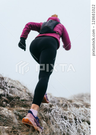 Trail Runner in Misty Mountain Landscape 128681022