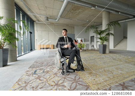 A director in a wheelchair sitting alone in an empty office, deeply reflecting on business strategies and decisions, contemplating the path forward with focused determination. 128681068