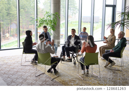 Corporate business team meeting with a manager or coach. Group of happy diverse, multiracial people sitting in a circle  128681263
