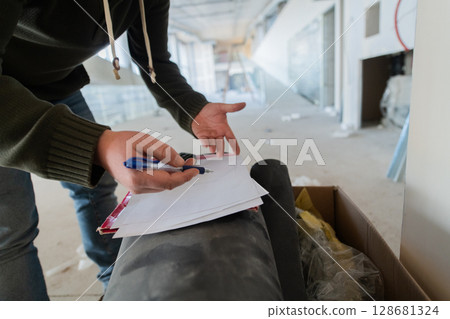 A close-up of an engineer's hand meticulously sketching an architectural project, capturing the precision, creativity, and focus involved in bringing innovative designs to life 128681324