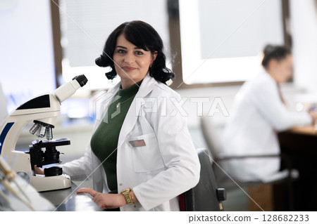 Doctor scientist using microscope in laboratory Doctor scientist using microscope in laboratory 128682233