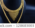Traditional Indian Gold Necklace on Black Display 128683003