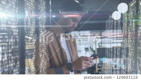 Image of biracial businessman using smartphone over data processing Image of biracial businessman using smartphone over data processing 128683128