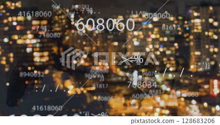 Image of falling numbers over night cityscape 128683206