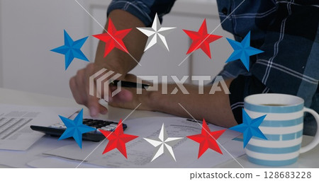 Image of stars over hands of biracial man using calculator Image of stars over hands of biracial man using calculator 128683228