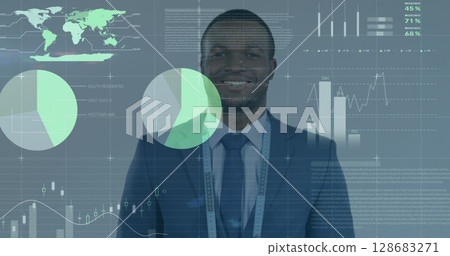 Statistical data processing against portrait of african american businessman smiling 128683271
