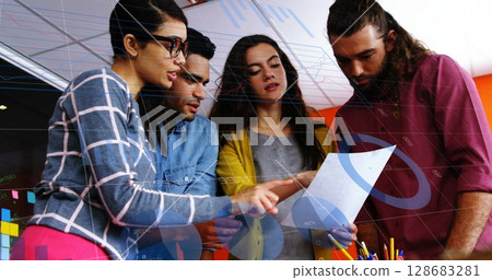 Statistical data processing against group of diverse office colleagues discussing together at office 128683281