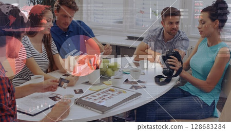 Statistical data processing against group of diverse office colleagues discussing together at office Statistical data processing against group of diverse office colleagues discussing together at office 128683284