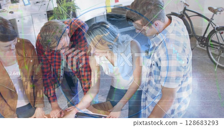 Spinning globe against group of diverse office colleagues discussing together at office 128683293