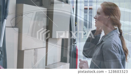Image of financial graphs over caucasian female courier with packages using smartphone Image of financial graphs over caucasian female courier with packages using smartphone 128683323