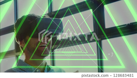 Image of tunnel with neon shapes over biracial man using vr headset Image of tunnel with neon shapes over biracial man using vr headset 128683481